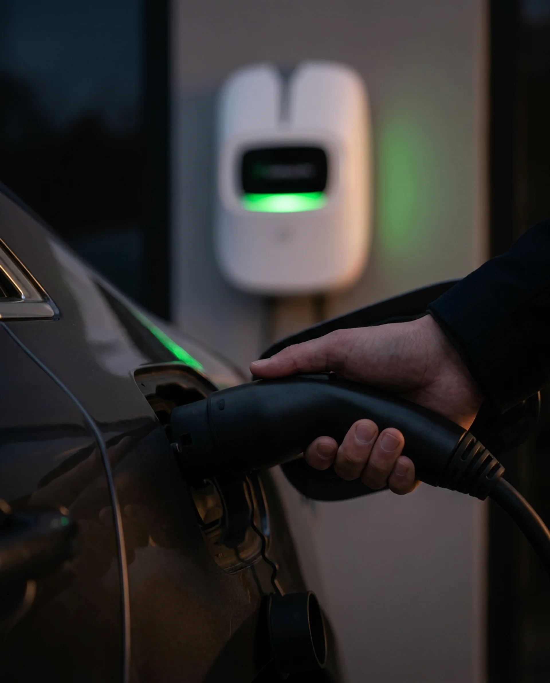 VoltHub home EV charger actively charging an electric vehicle